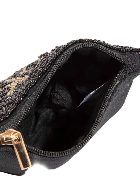 Black beaded clutch bag with gold accents on a light gray background