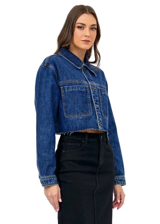 Woman wearing a blue denim jacket on a white background