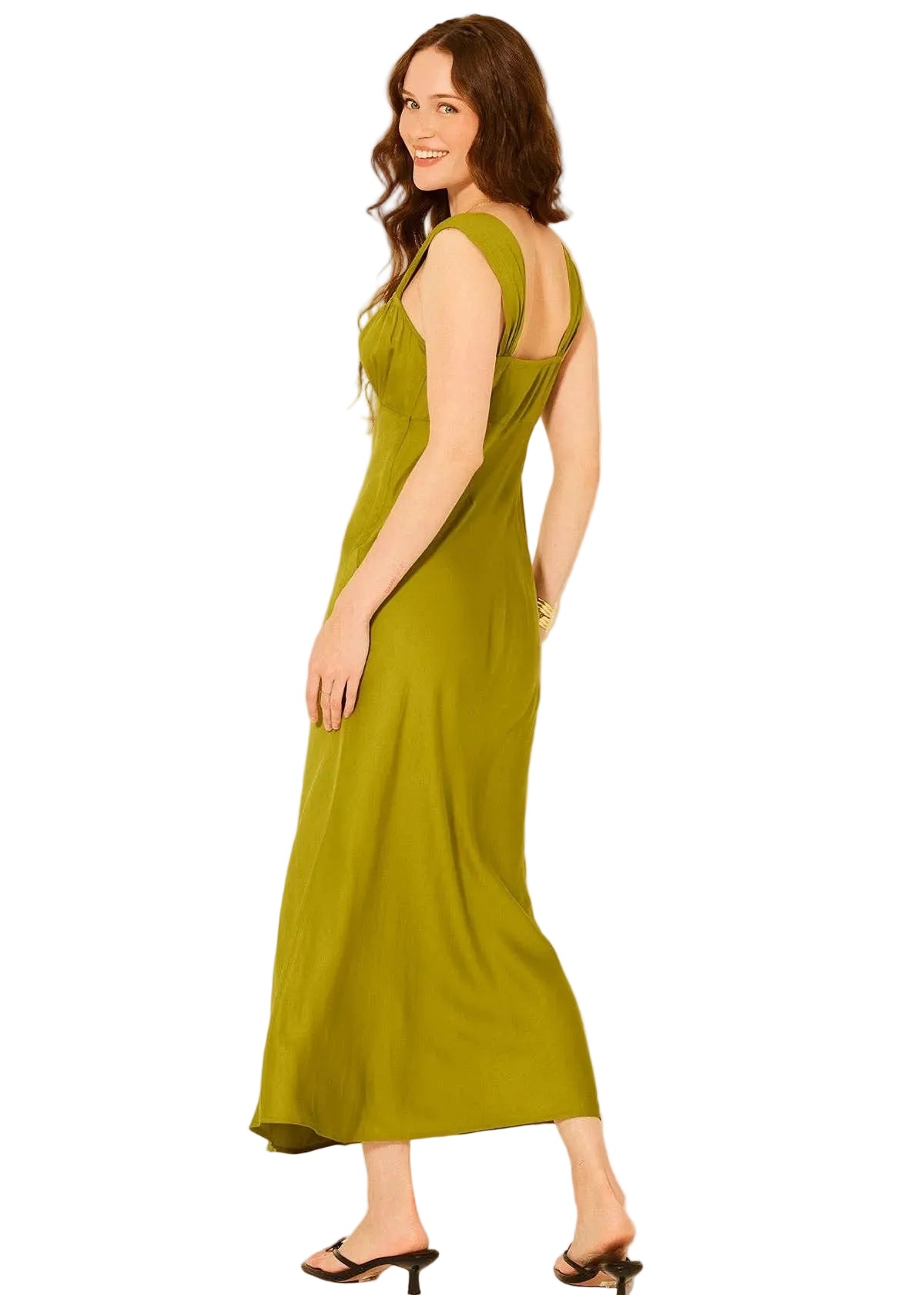 Woman wearing a green dress on a white background