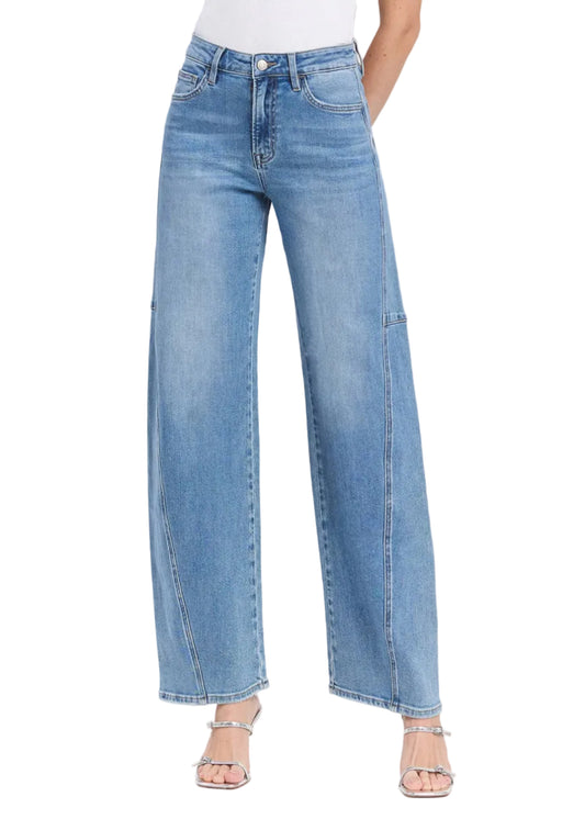 Blue jeans worn by a person on a white background