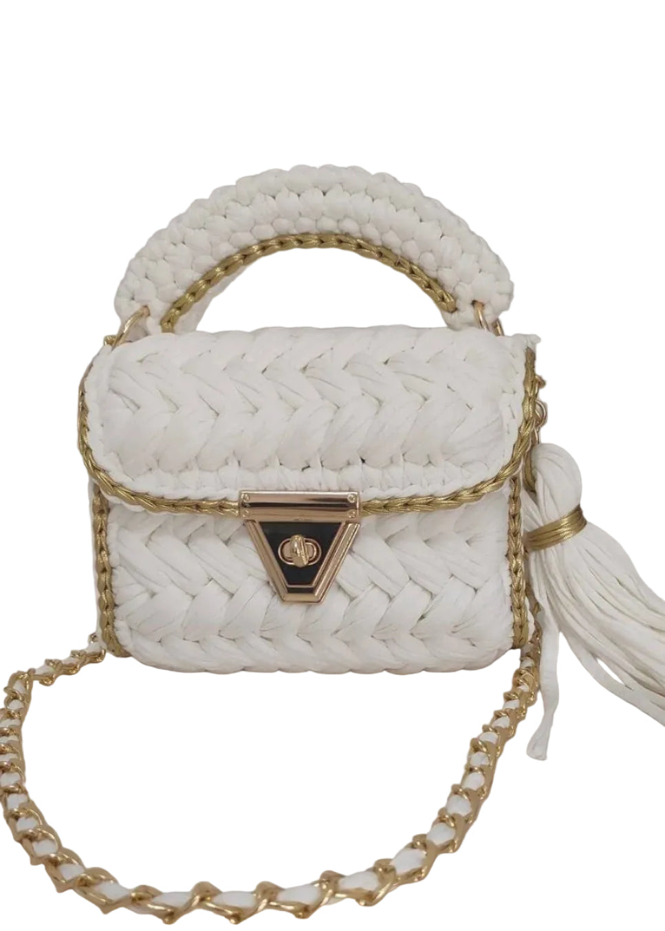 A white handmade crochet bag with a geometric pattern, featuring a gold chain strap, a gold clasp, and a tassel.