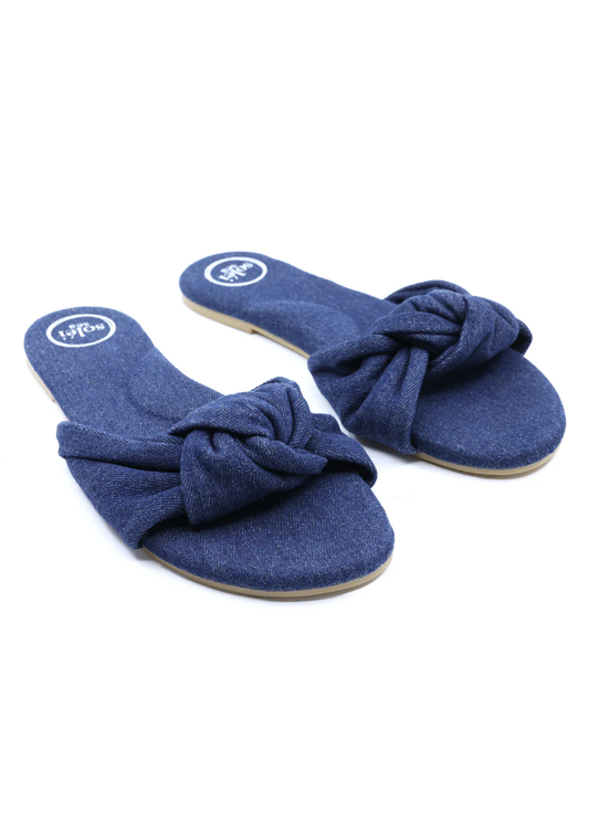 Pair of blue sandals with knot design on a white background