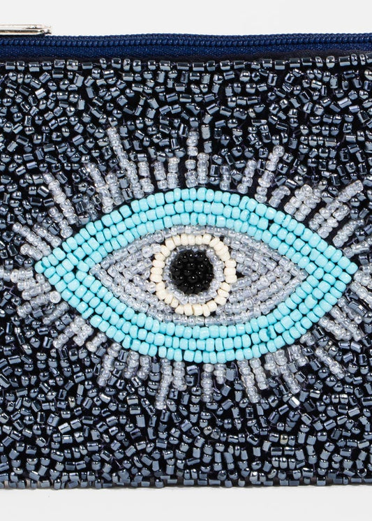 Beaded clutch with eye design on a white background