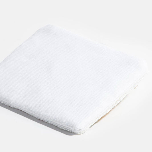 White mattress pad on a white background
