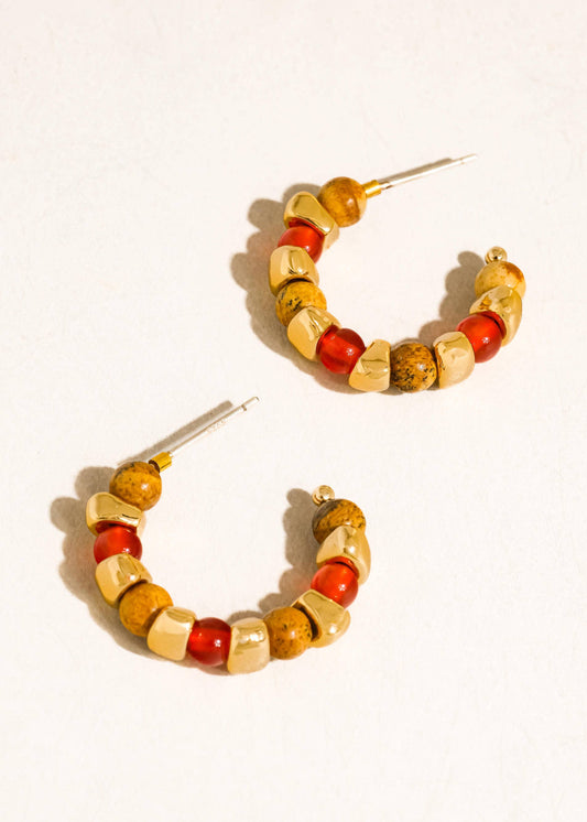 Hoop earrings with multicolored beads on a white background