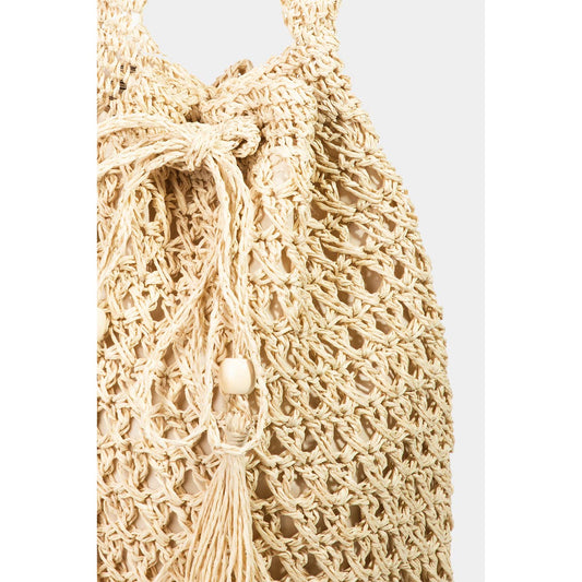Beige woven bag with a white background
