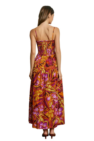 Woman wearing a floral dress with a neutral background