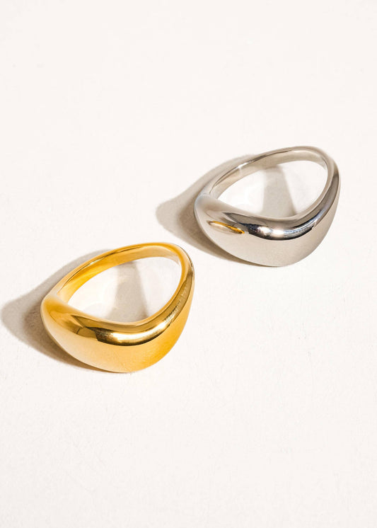 Two gold and silver rings on a white background
