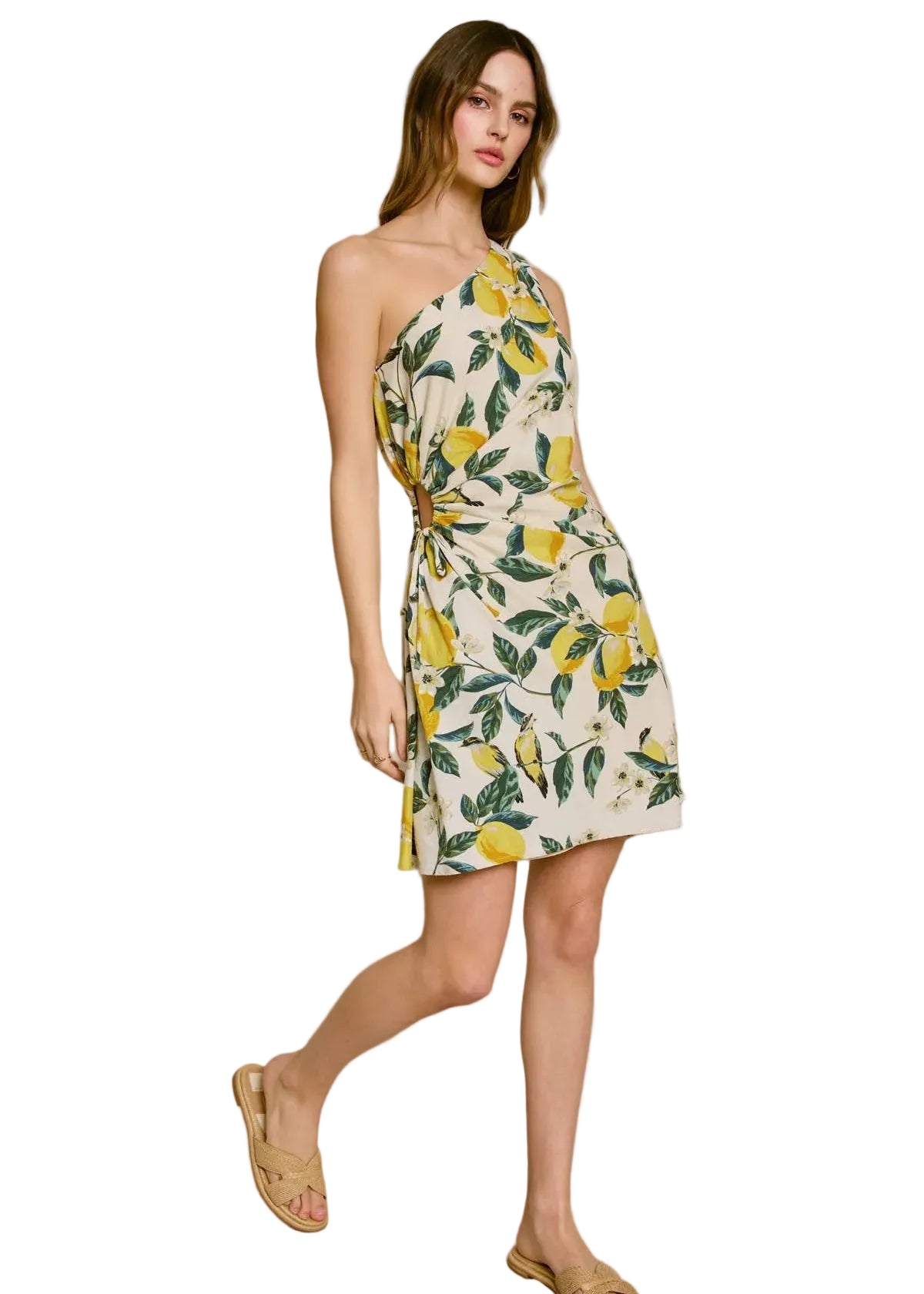 Woman wearing a floral dress with lemon pattern on a white background