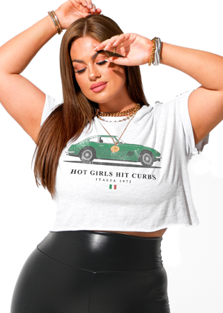 Woman wearing a white t-shirt with a graphic design and text.