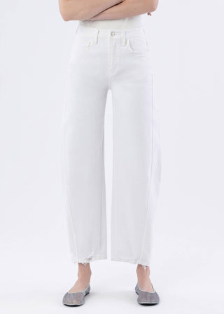 White pants worn by a person on a white background