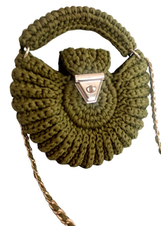 Handmade crocheted green bag with a round shape, featuring a gold-tone handle and hardware.