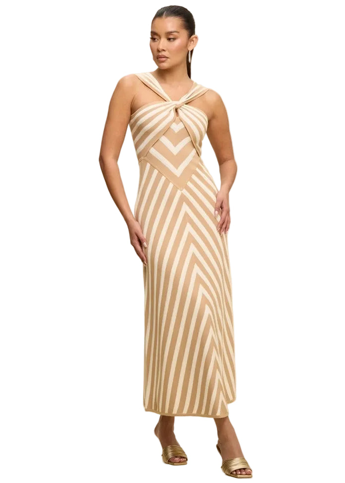 Woman wearing a beige and white striped dress on a white background