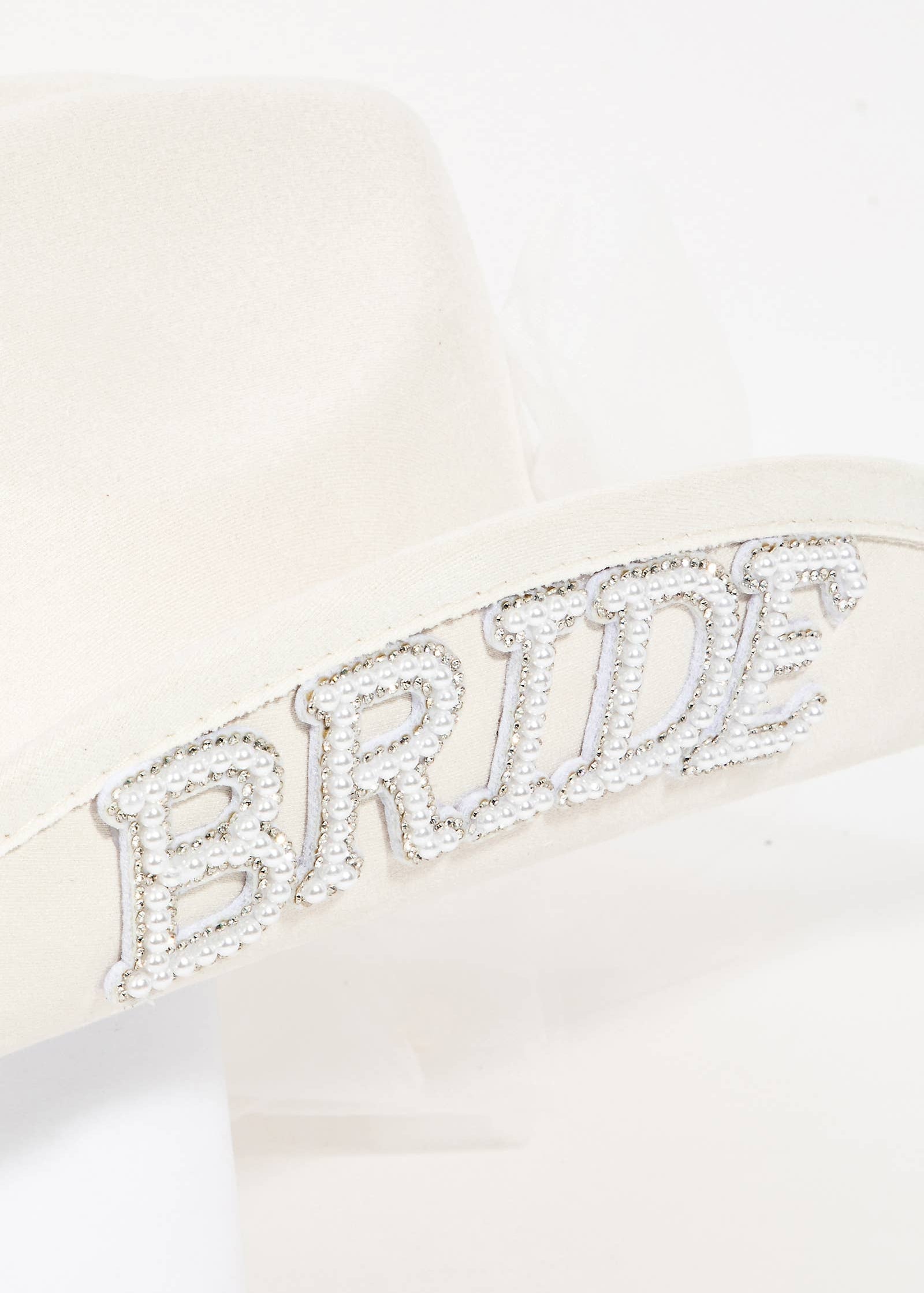 Bridal sash with 'BRIDE' embellishments on a white background