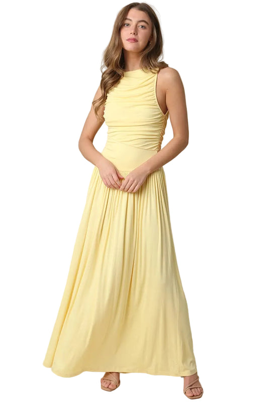 Woman wearing a yellow sleeveless dress on a white background