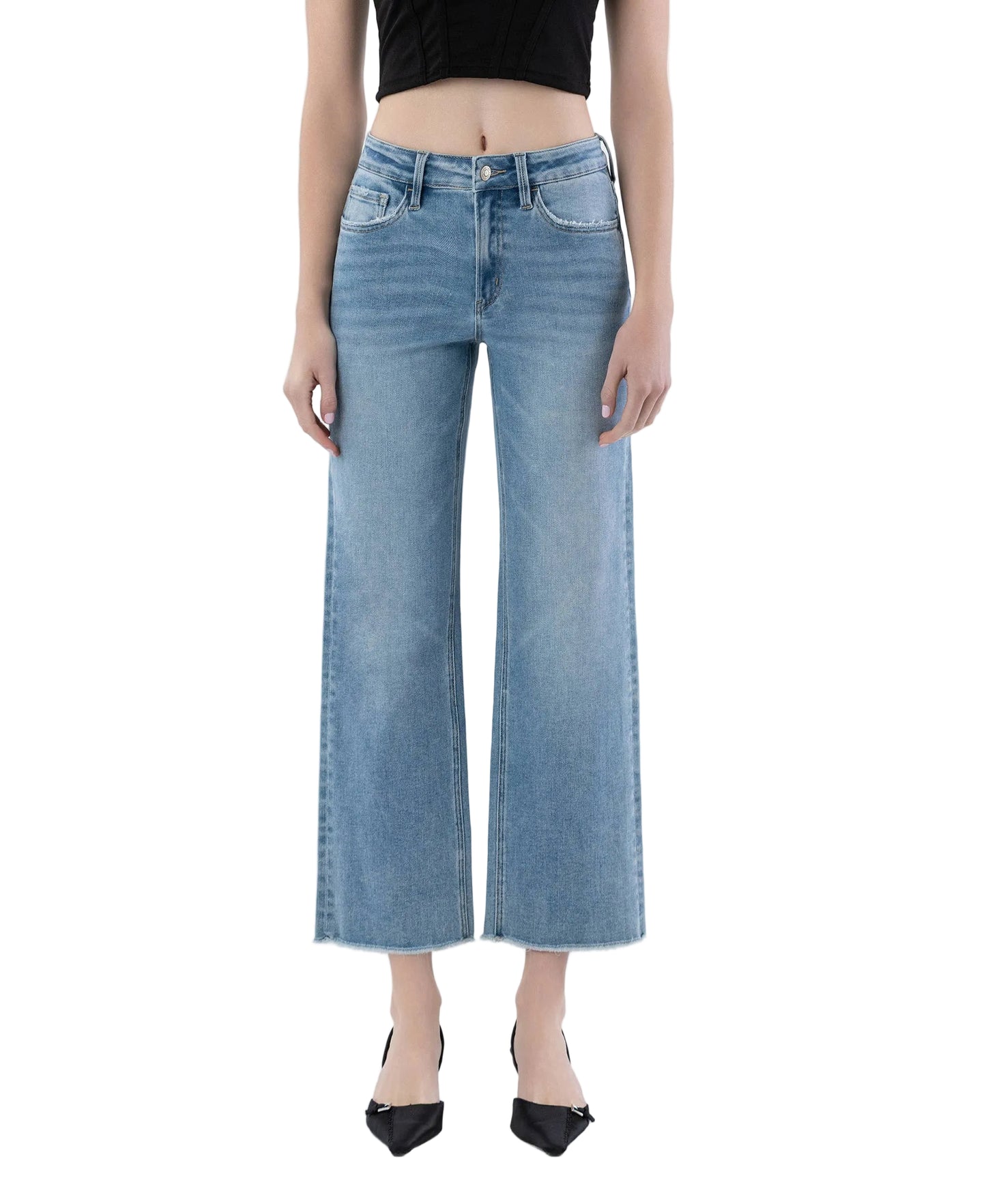 Person wearing light blue jeans on a white background