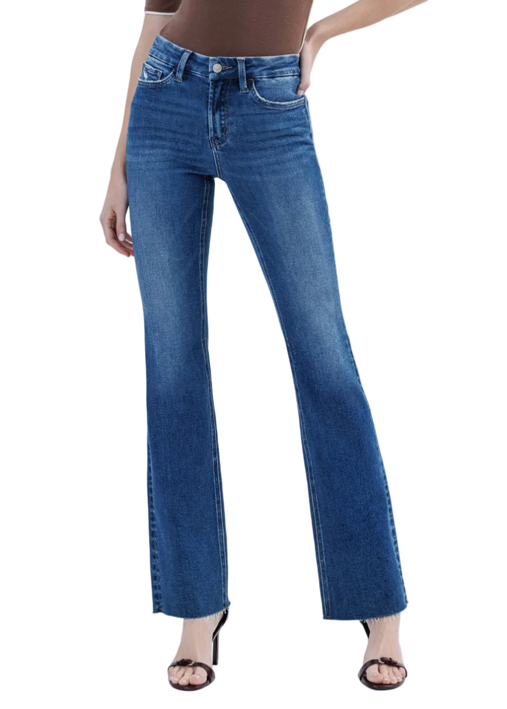 Blue jeans worn by a person on a white background