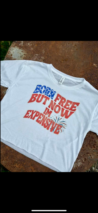 White t-shirt with colorful text on a textured surface