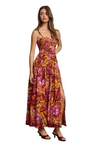 Woman wearing a floral dress with a neutral background