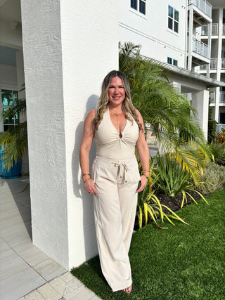 women in halter top with tropical background