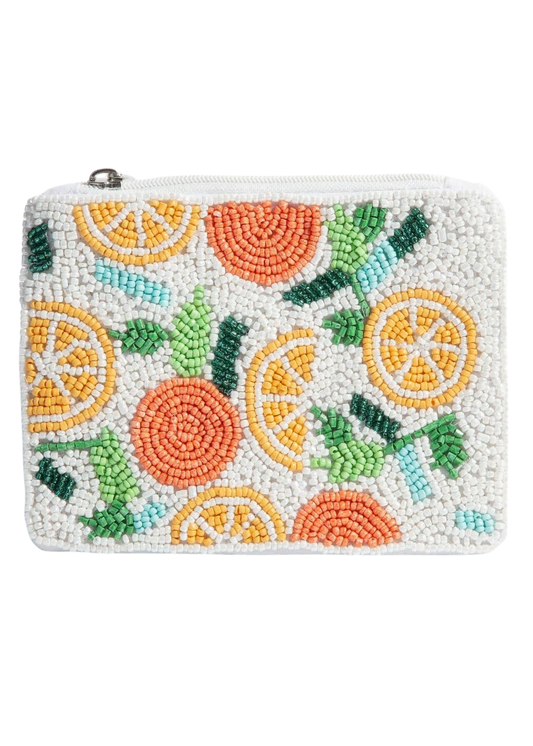 Beaded clutch with fruit pattern on a white background
