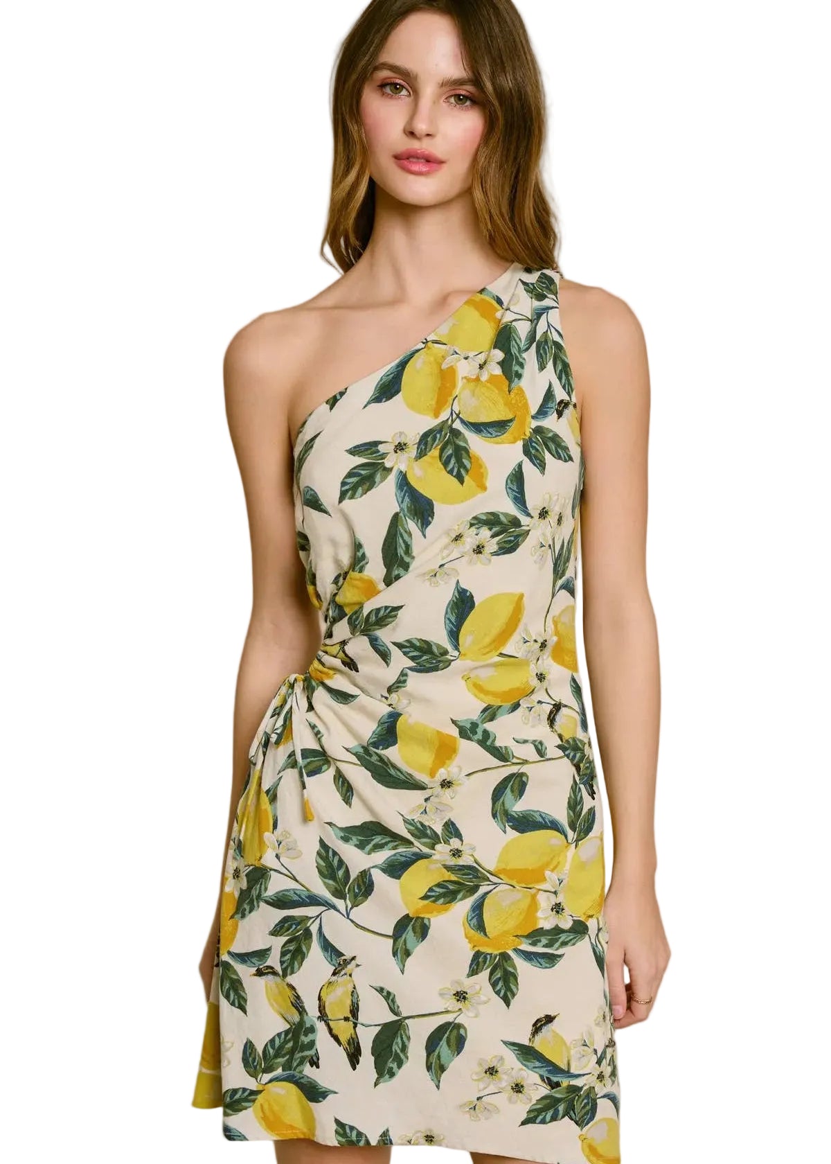 Woman wearing a one-shoulder dress with lemon print on a white background