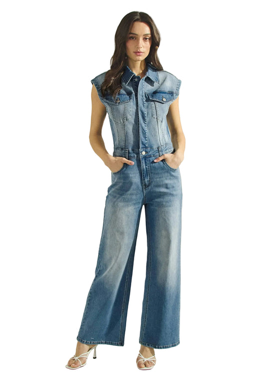 Woman wearing a denim jumpsuit with  wide-leg jeans on a beige background