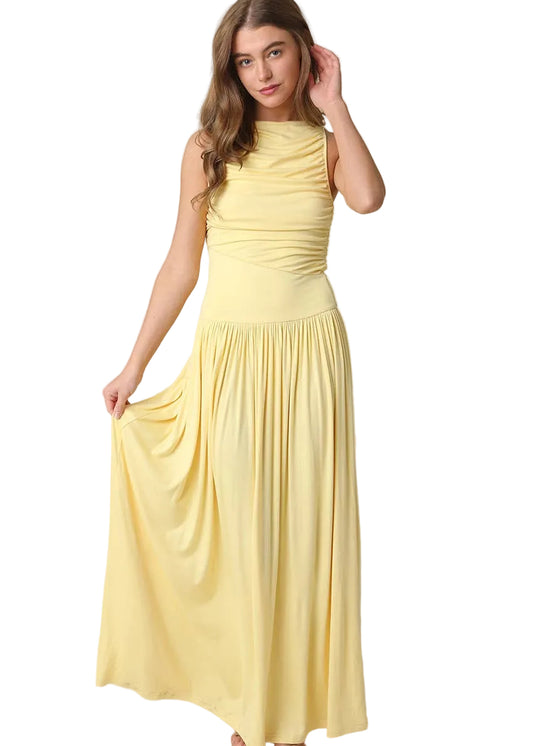 Woman wearing a yellow dress against a beige background