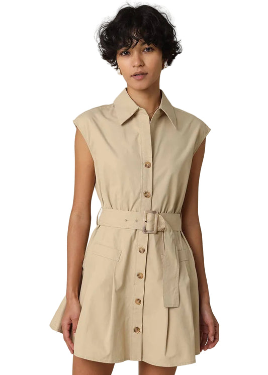 Woman wearing a beige sleeveless dress with buttons on a beige background