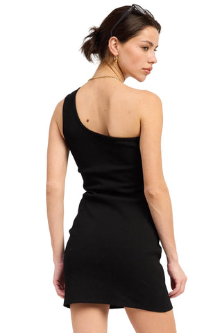 Woman wearing a black dress with a plain background