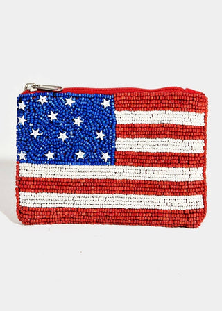 Purse with American flag design made of beaded stars and stripes on a white background