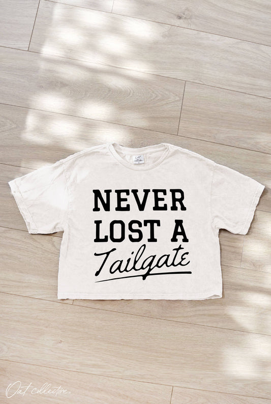 NEVER LOST A TAILGATE  Cropped Graphic Top