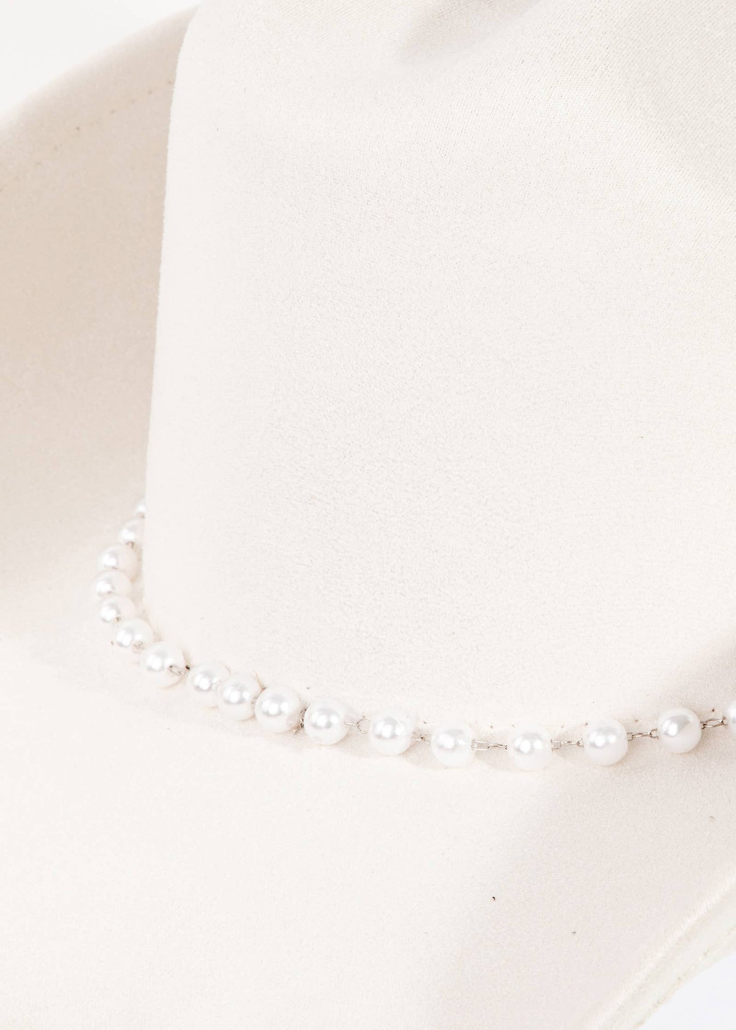 Pearl necklace on a white background