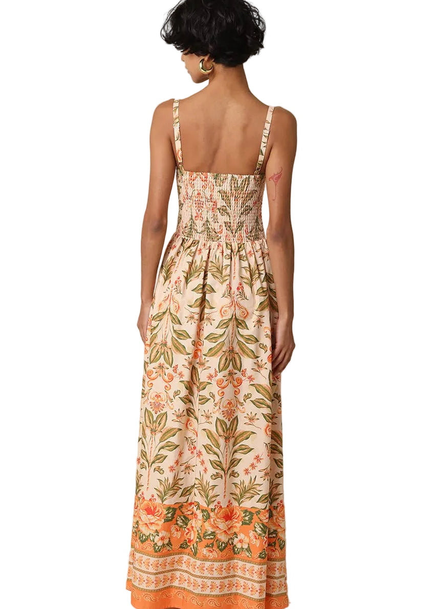 Woman wearing a floral dress with a beige background