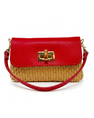Red handbag with a woven base on a white background